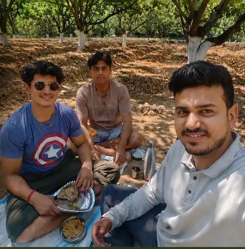 The DK Nature Farms family sharing lunch together in the orchard